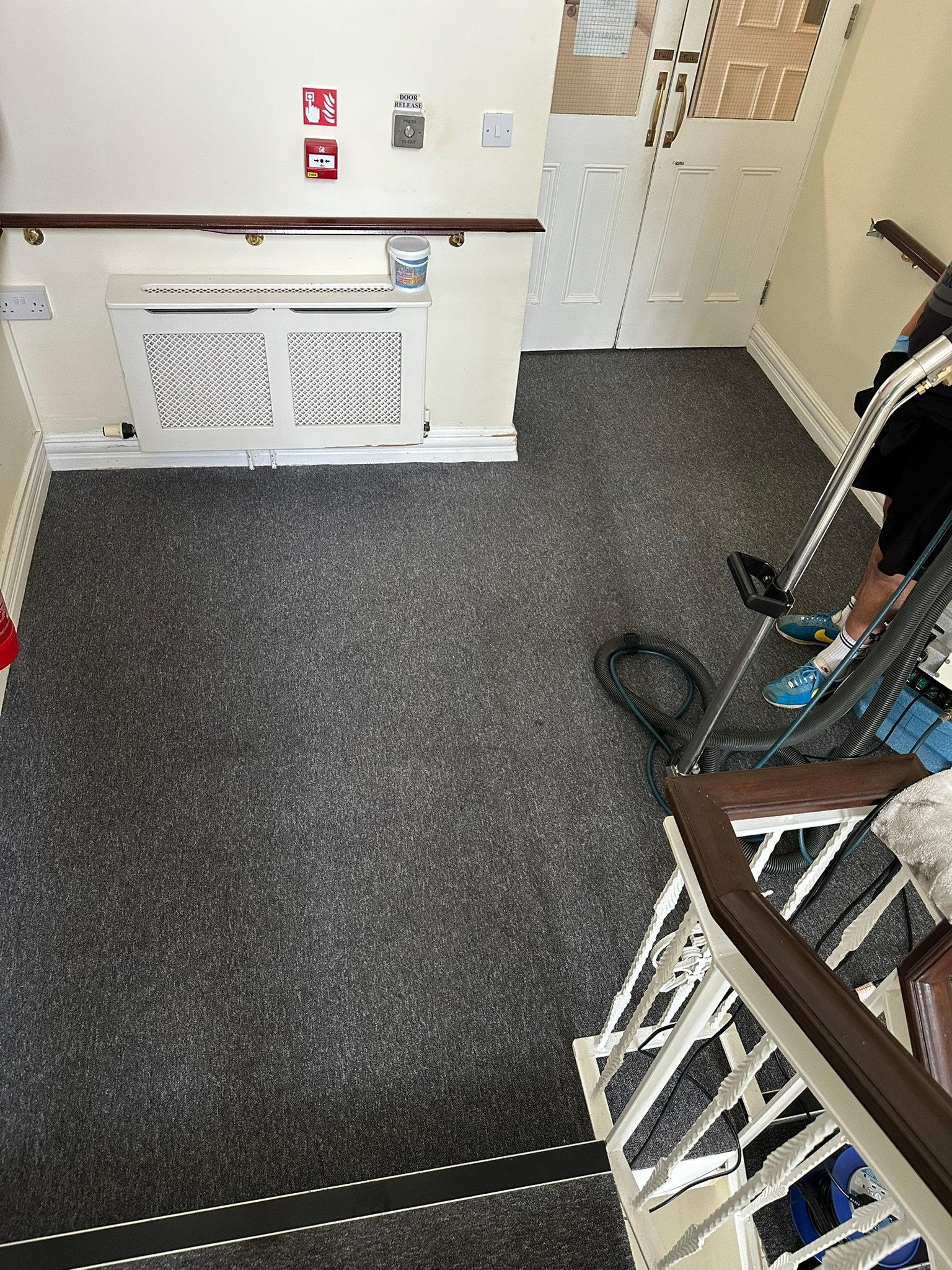 Hotel Staircase Carpet Deep Cleaning – Hand Scrubbing Treatment Technician hand scrubbing hotel staircase carpet during deep cleaning treatment