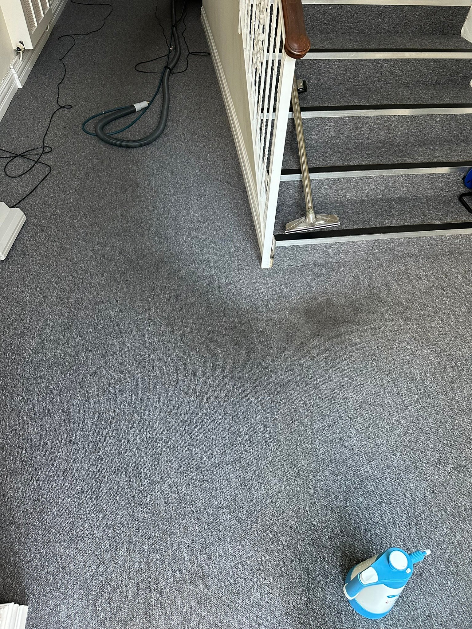 Hotel Landing Carpet Deep Cleaning – Extraction Wand Treatment Carpet extraction cleaning wand tool on hotel landing near staircase